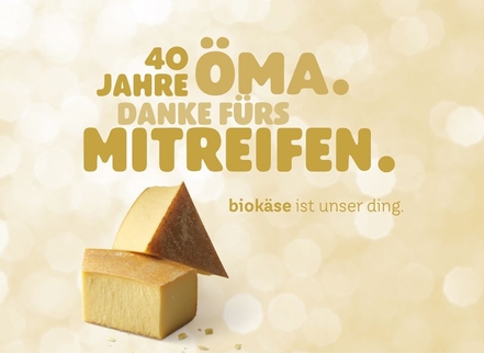 Das Bild feiert 40 Jahre ÖMA und bedankt sich für das Mitreifen von Bio-Käse.